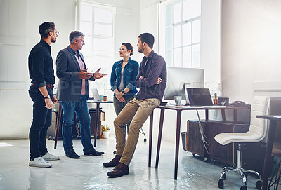 Buy stock photo Shot of a group of designers having a discussion at work