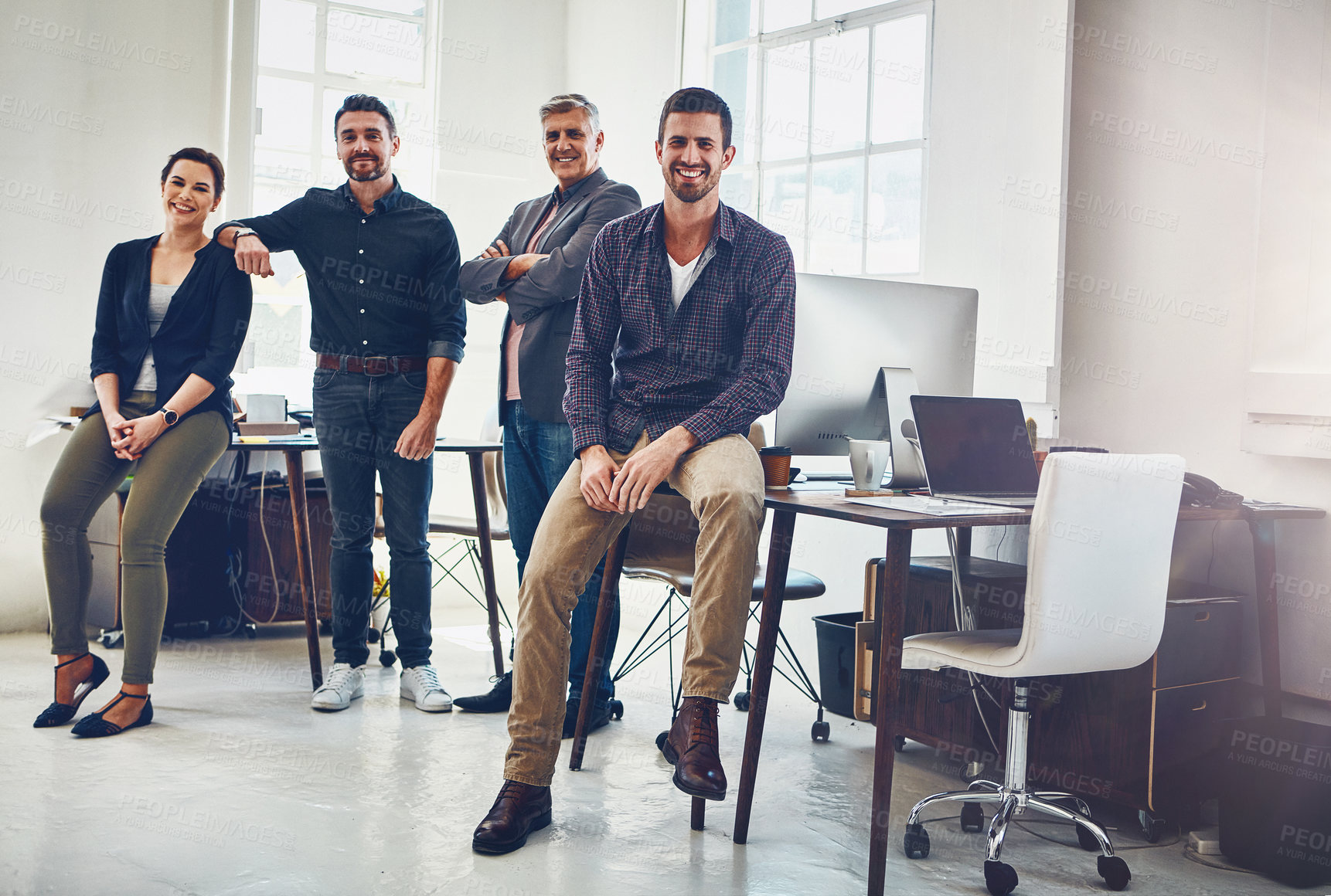 Buy stock photo Portrait of a team of creative workers standing together in an office