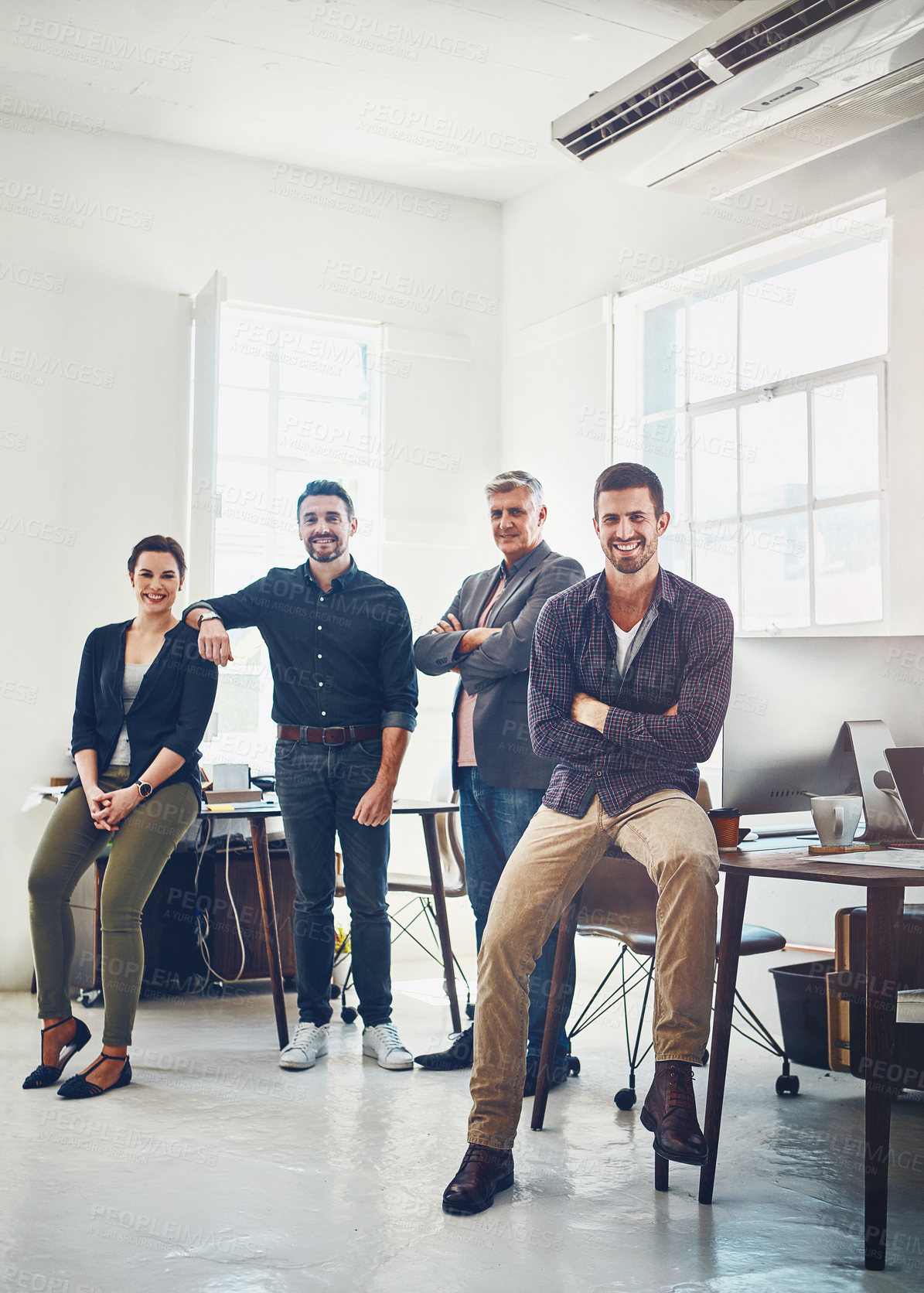 Buy stock photo Portrait of a team of creative workers standing together in an office