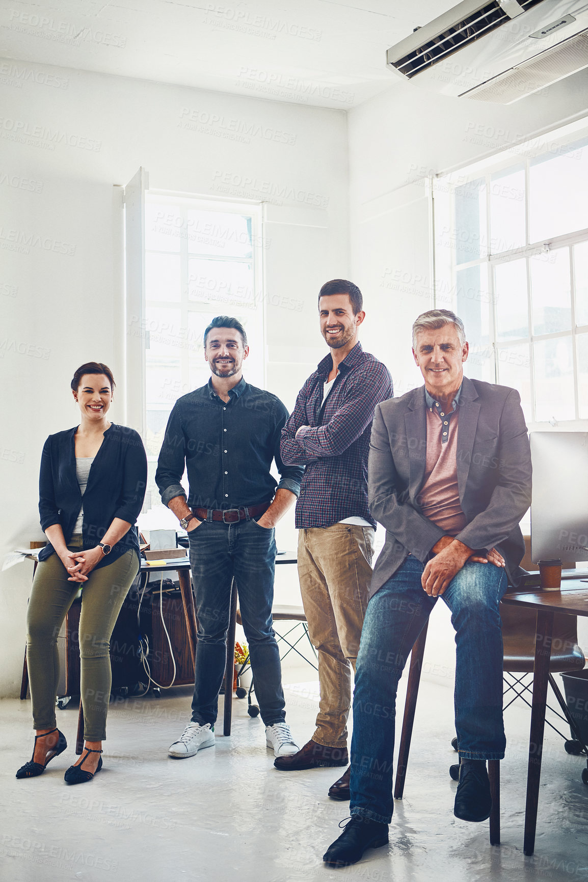 Buy stock photo Portrait of a team of creative workers standing together in an office