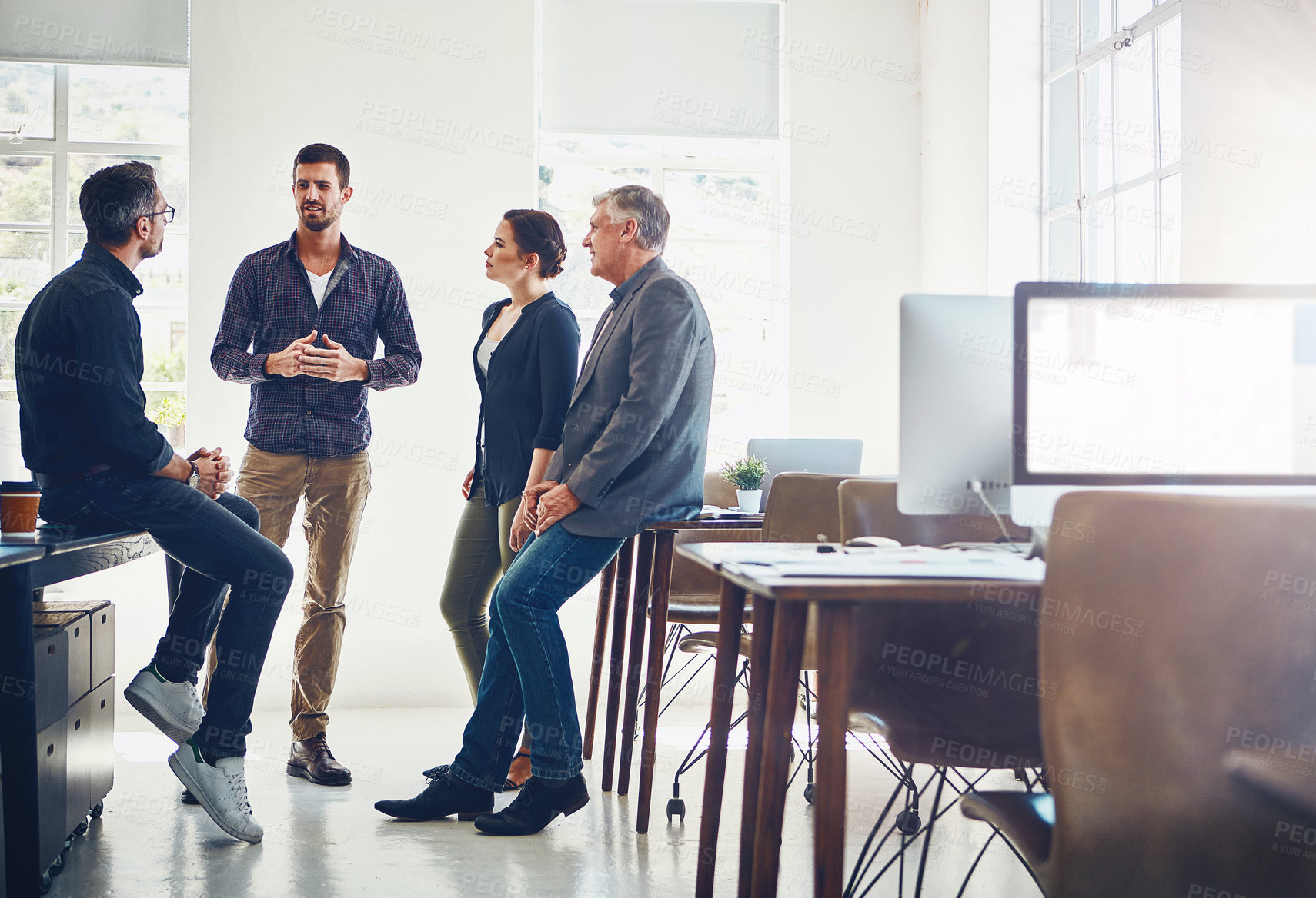 Buy stock photo Shot of a group of designers having a discussion at work