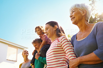 Buy stock photo Outdoor, house and grandmother with family in summer on holiday or vacation in retirement with support. Happy, senior woman and relax with kids and parents in backyard with care for generations