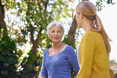 Buy stock photo Shot of a mother and daughter taking a walk outside