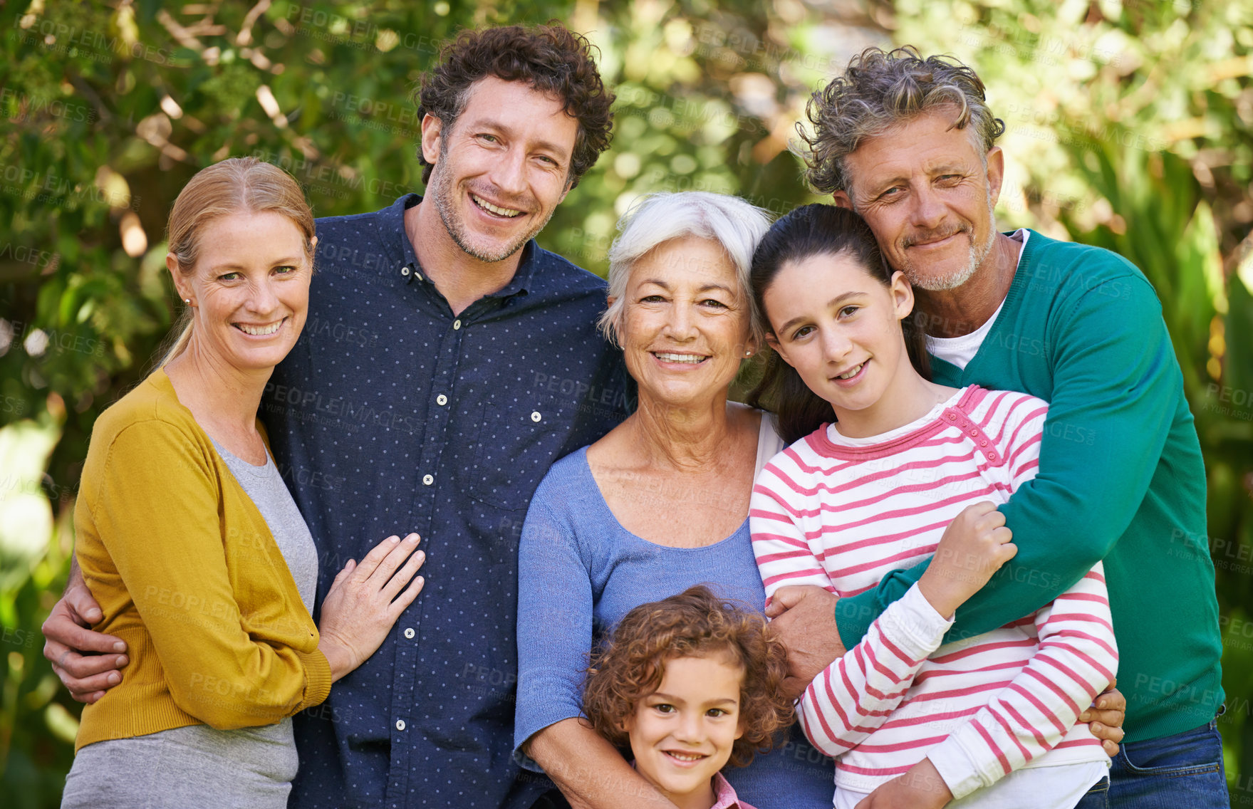 Buy stock photo Shot of a family posing for a photograph outdoors