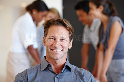 Buy stock photo Portrait, happy and man with creative team in office, entrepreneur with businesspeople in meeting for collaboration. Startup, working with smile male person, new job opportunity with confidence