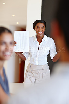 Buy stock photo Presentation, business and black woman in meeting with documents for discussion, strategy and review in boardroom. Smile, paperwork and female employee for financial report, feedback or planning