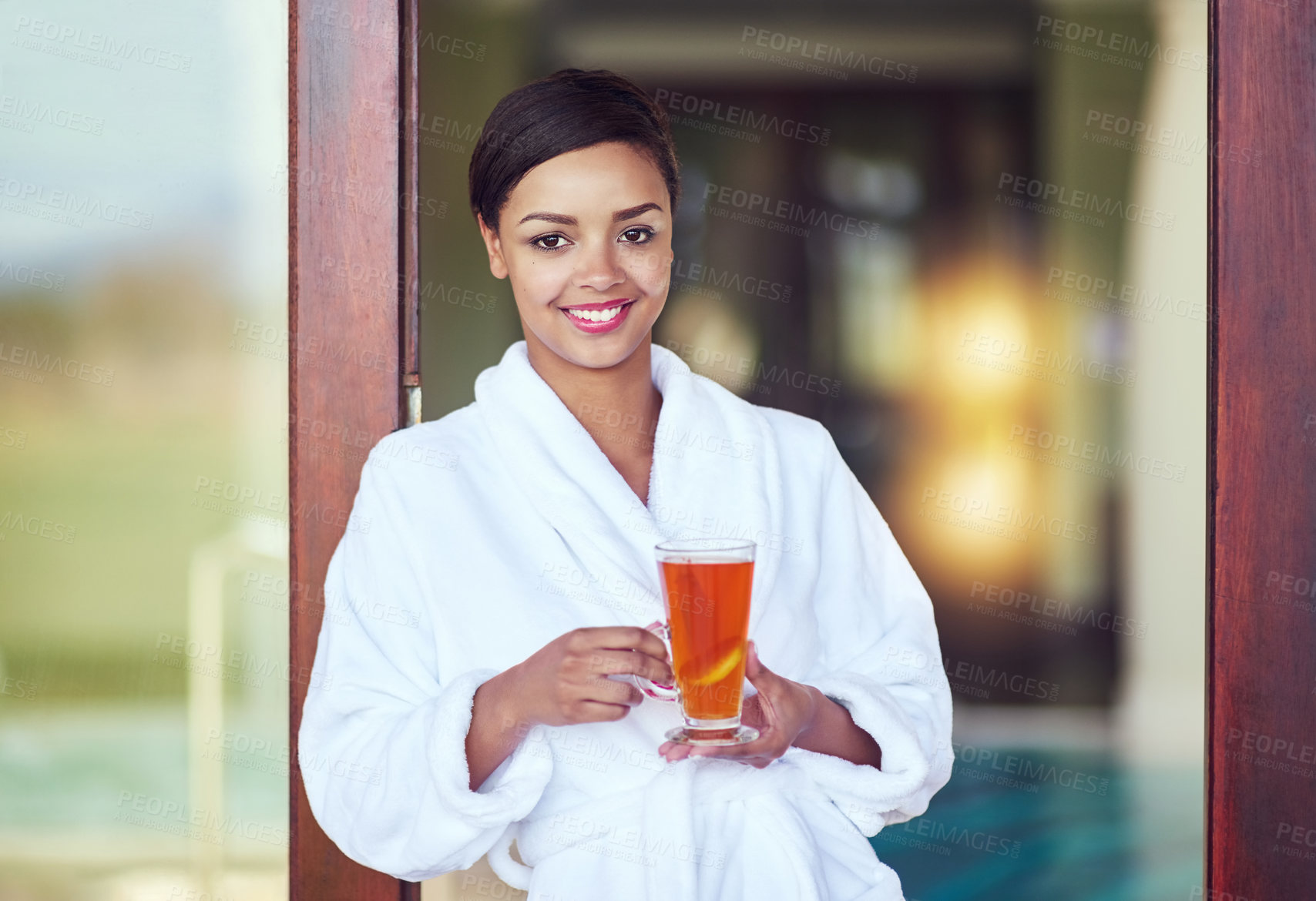 Buy stock photo Portrait, woman and smile at spa with tea on holiday, relax and break for luxury and mindfulness. Female person, resort and happy with herbal drink on vacation, trip and travel for wellness at hotel