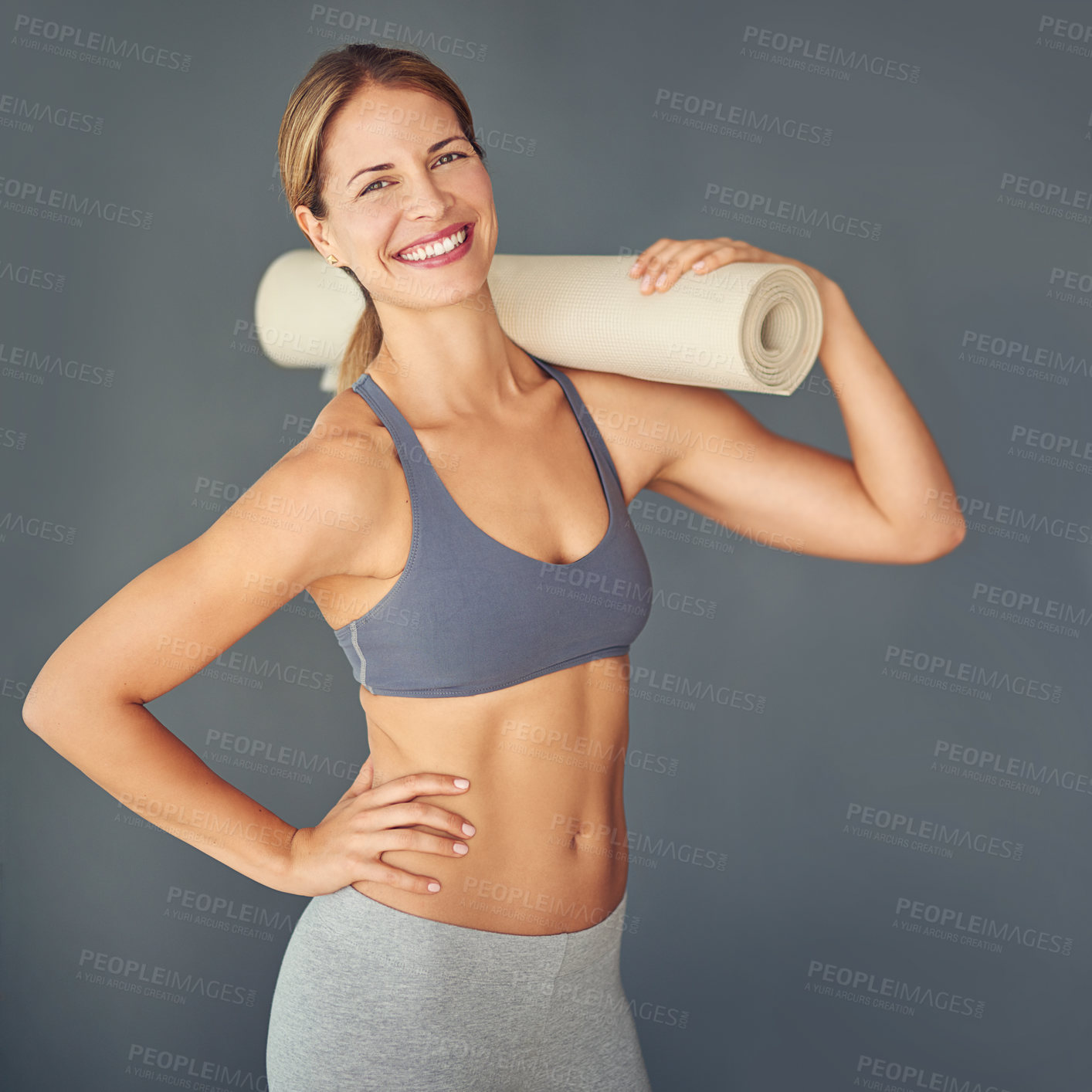 Buy stock photo Happy woman, portrait and fitness body with yoga mat for zen workout or exercise against a grey studio background. Female person or yogi with smile for healthy wellness, mental health and pilates