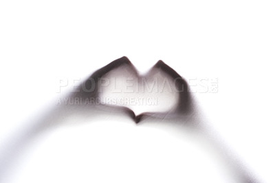 Buy stock photo Cropped shot of an unrecognizable person's hands making a heart sign