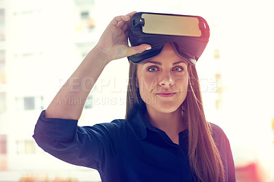 Buy stock photo Portrait of a young businesswoman wearing a VR headset in an office