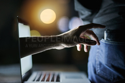 Buy stock photo Shot of a disembodied hand reaching through a laptop screen to steal a credit card