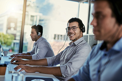 Buy stock photo Customer service, smile and coworking, portrait of happy man consulting with advice, computer and team at help desk. Phone call, conversation and happiness, callcenter consultant in modern office.