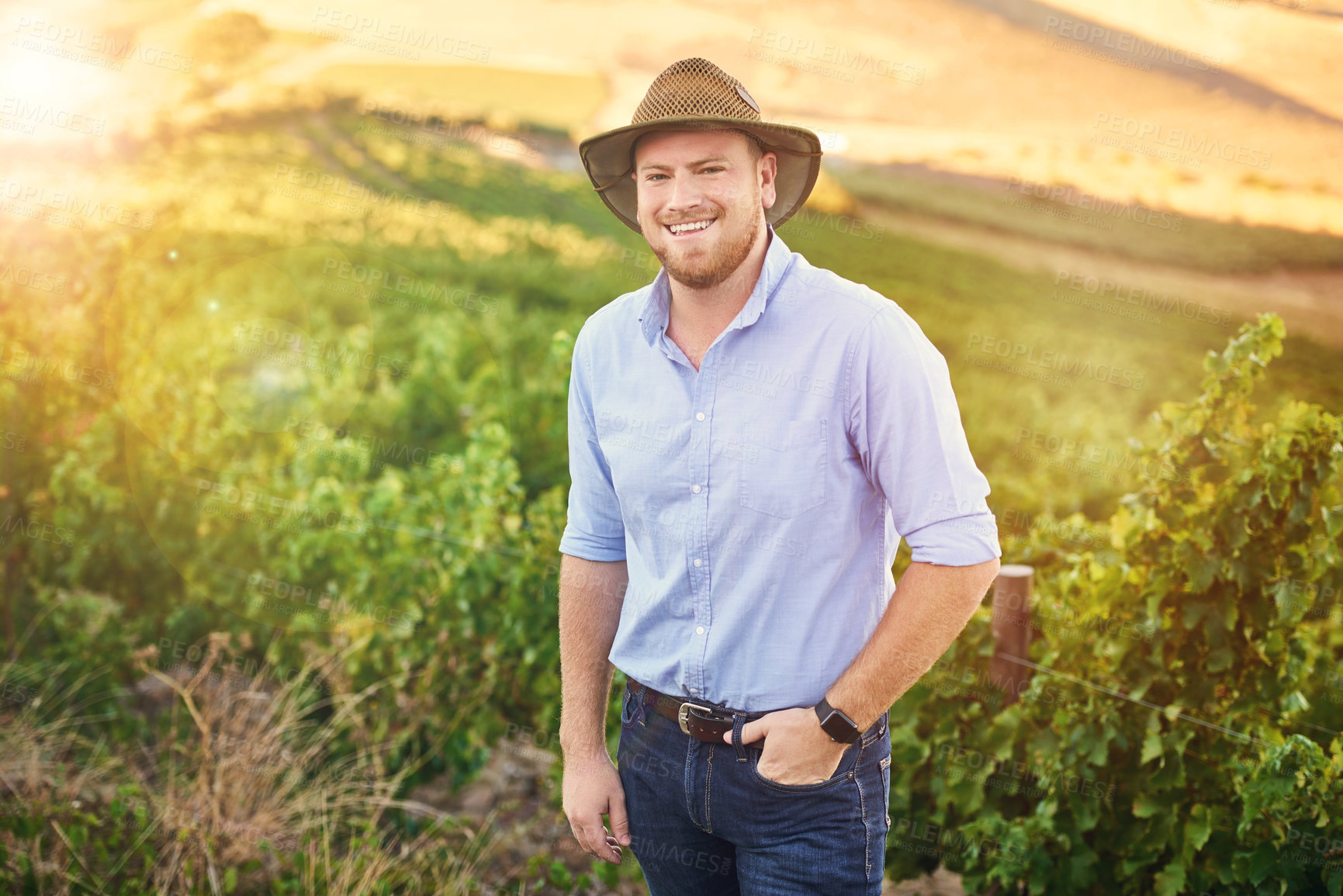 Buy stock photo Farmer, happy and man with portrait at vineyard for agriculture, production and sustainability. Confident, viticulturist and smile with leaves for eco friendly, development and gardening in France