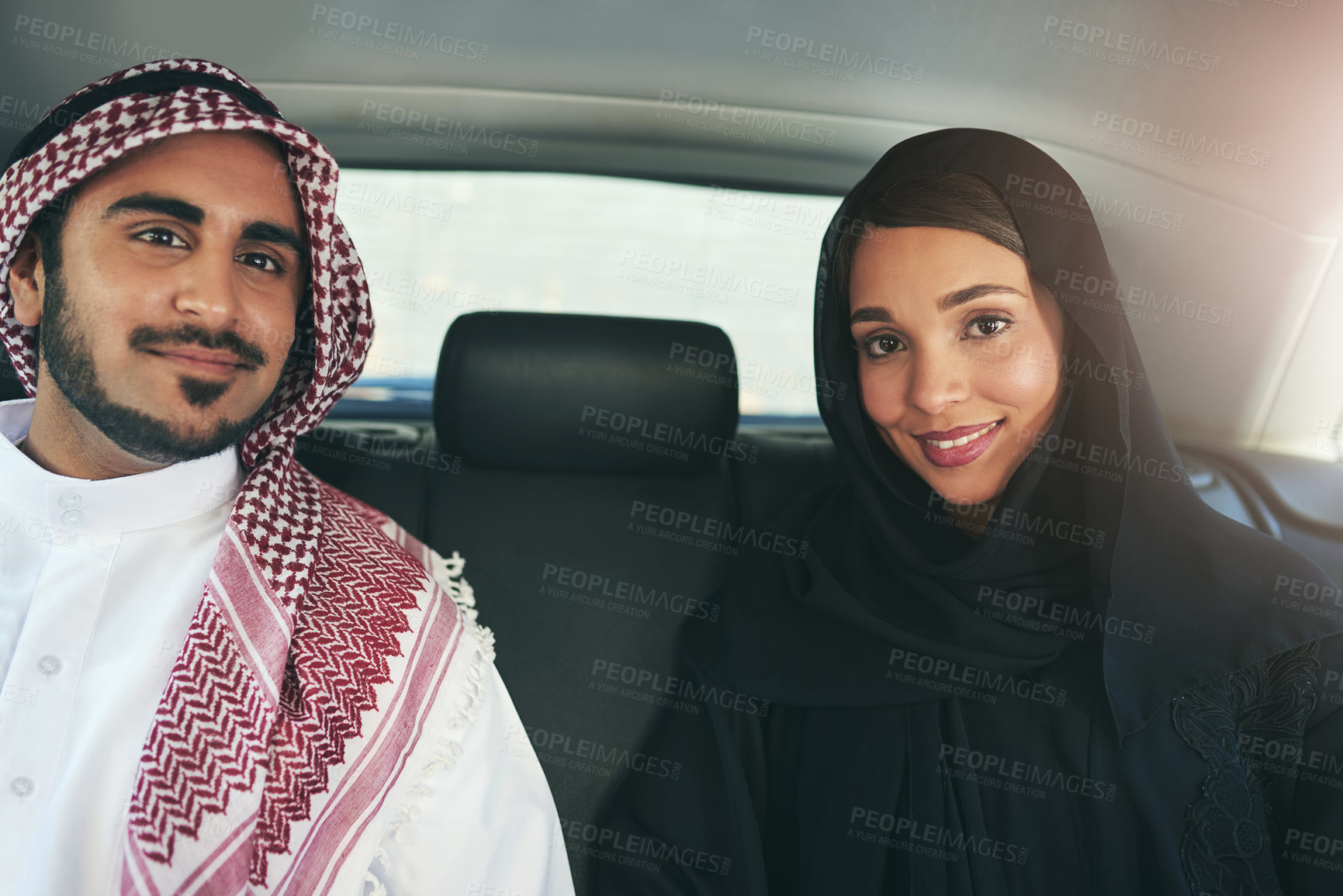 Buy stock photo Arabic couple, transport and portrait in car for chauffeur service, commute or morning flight at airport. Lens flare, hijab woman and muslim man with keffiyeh for travel, passenger or backseat taxi