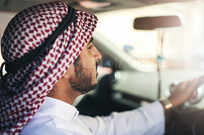 Buy stock photo Shot of a young muslim businessman driving a luxury car