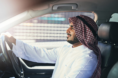 Buy stock photo Shot of a young muslim businessman driving a luxury car