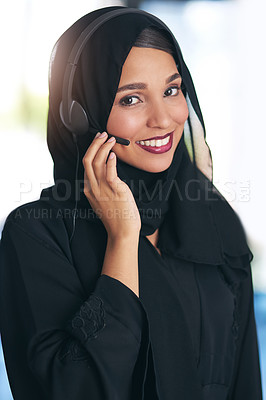 Buy stock photo Portrait of a friendly young muslim call center agent working in a modern office