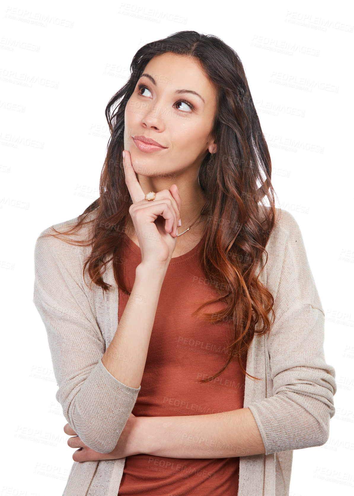 Buy stock photo Shot of a happy young woman looking thoughtful while posing in the studio