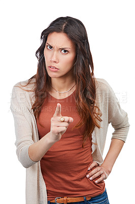 Buy stock photo Portrait of an angry young woman wagging her finger in studio