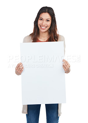 Buy stock photo Portrait of a confident young woman holding a blank white sign in studio