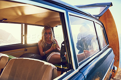 Buy stock photo Portrait of a happy young woman sitting inside a car during a roadtrip