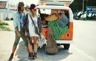 Buy stock photo Cropped shot of young hipster couple standing outside next to a camper van