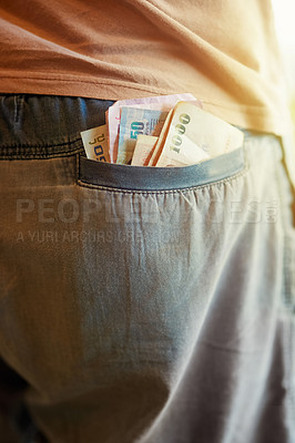 Buy stock photo Cropped closeup shot of a many with Thai baht sticking out of his back pocket