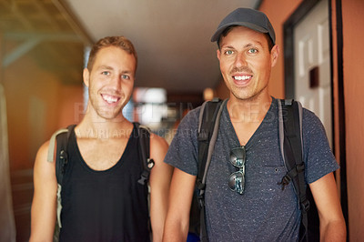 Buy stock photo Portrait of two smiling young friends wearing backpacks traveling together in Thailand
