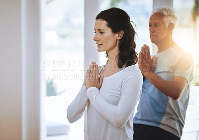 Buy stock photo Shot of a teacher taking a senior man through a yoga class