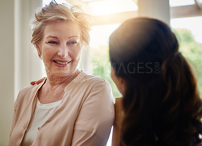 Buy stock photo Shot of a smiling senior woman talking with a nurse in assisted living facility