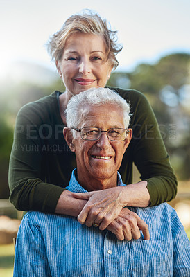 Buy stock photo Portrait of a mature couple posing together in their backyard
