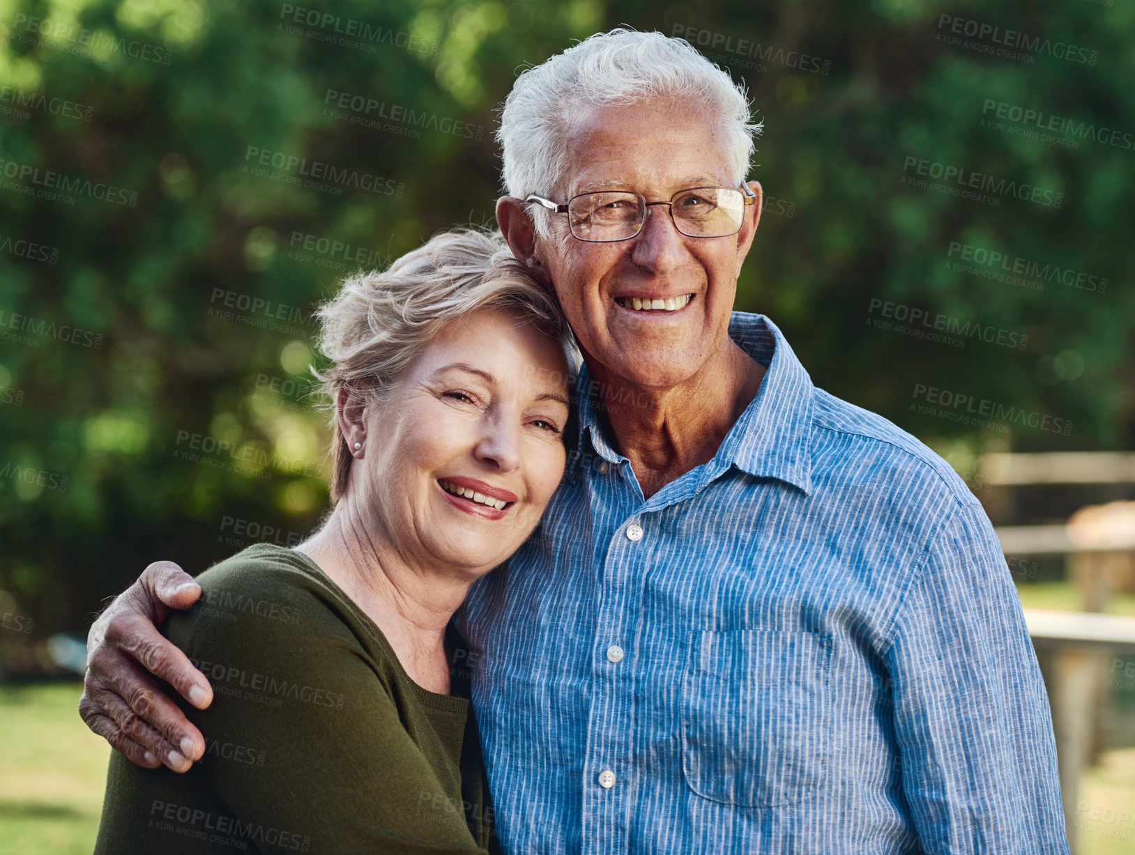 Buy stock photo Portrait of a mature couple posing together in their backyard