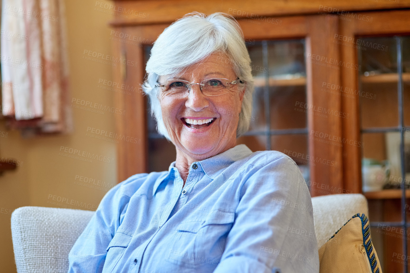 Buy stock photo Portrait of a senior woman relaxing at home