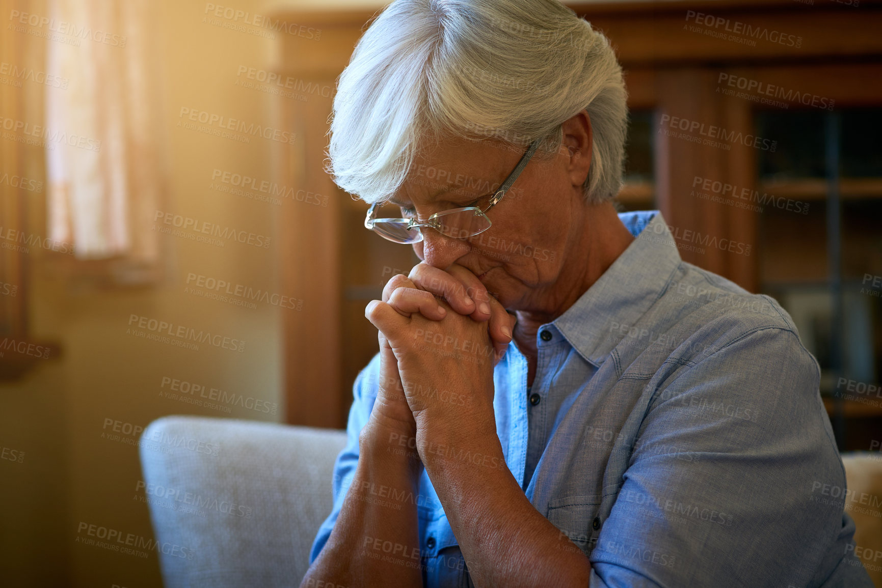 Buy stock photo Worry, praying or senior woman with stress in with memory, trauma or fear on chair thinking alone. Nervous, remember or scared elderly lady with decision, anxiety or depression in retirement or house