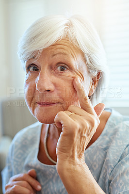 Buy stock photo Portrait of a happy senior woman showing off her wrinkles at home