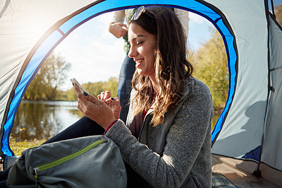 Buy stock photo Cropped shot of an affectionate young couple at their campsite