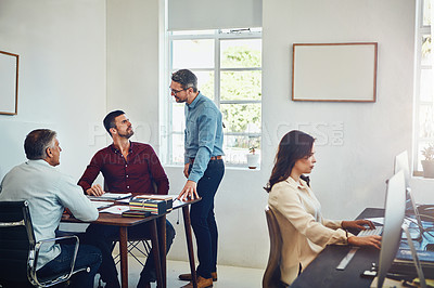 Buy stock photo Cropped shot of a group of colleagues working in their creative office