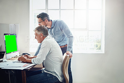Buy stock photo Cropped shot of a mature businessman getting assistance from a colleague in the office