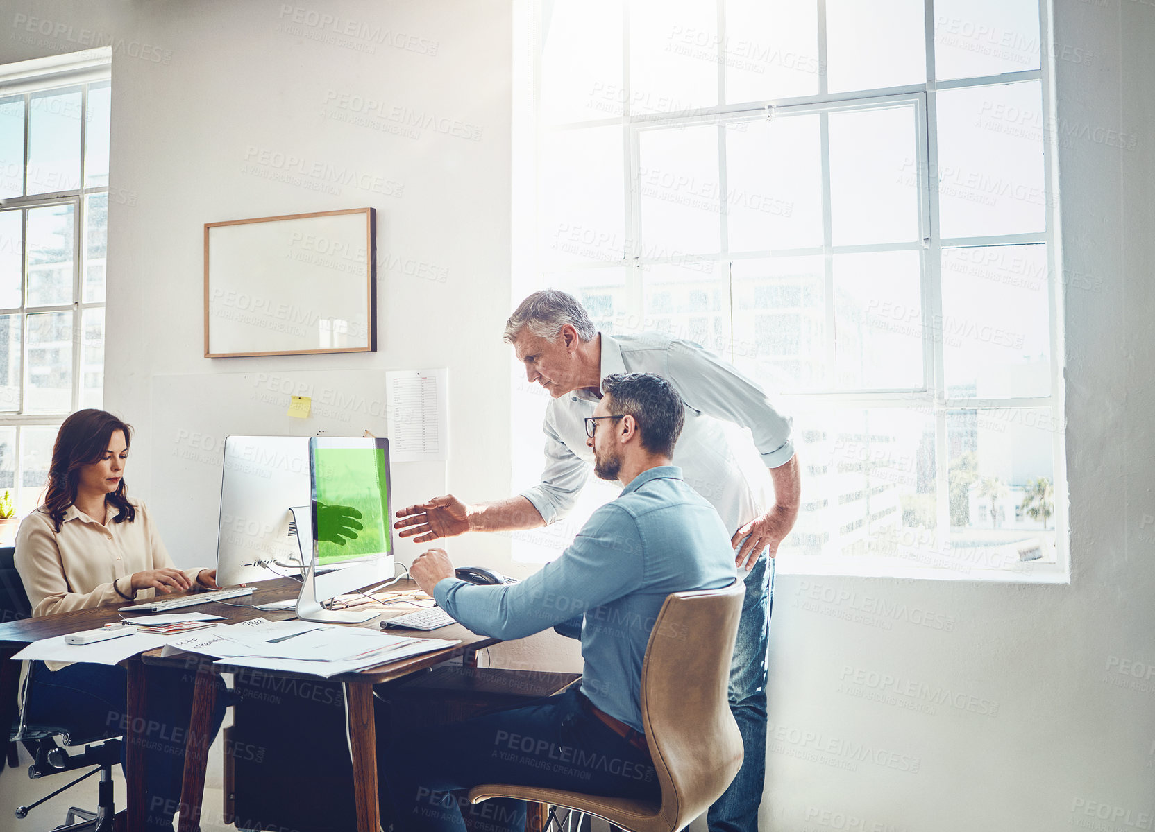 Buy stock photo Cropped shot of a mature businessman getting assistance from a colleague in the office