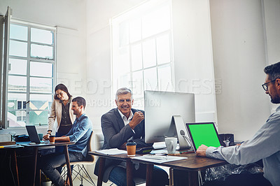 Buy stock photo Portrait, teamwork and business man by computer in office workplace. Laptop, mockup green screen and elderly male employee working on marketing, advertising or sales project with people or coworkers.