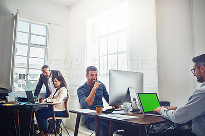 Buy stock photo Portrait, teamwork and business man by computer in office workplace. Laptop, mockup green screen and young male employee working on marketing, advertising or sales project with people or coworkers