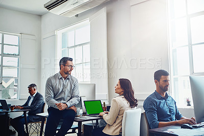 Buy stock photo Teamwork, laptop green screen and business people in office talking, discussion or conversation. Collaboration, mock up and employees, man and woman planning marketing, advertising or sales project