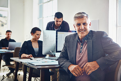 Buy stock photo Senior, portrait and business man in office or company workplace. Leadership, ceo and happy elderly male employee or manager with colleagues working on marketing report, advertising or sales project.