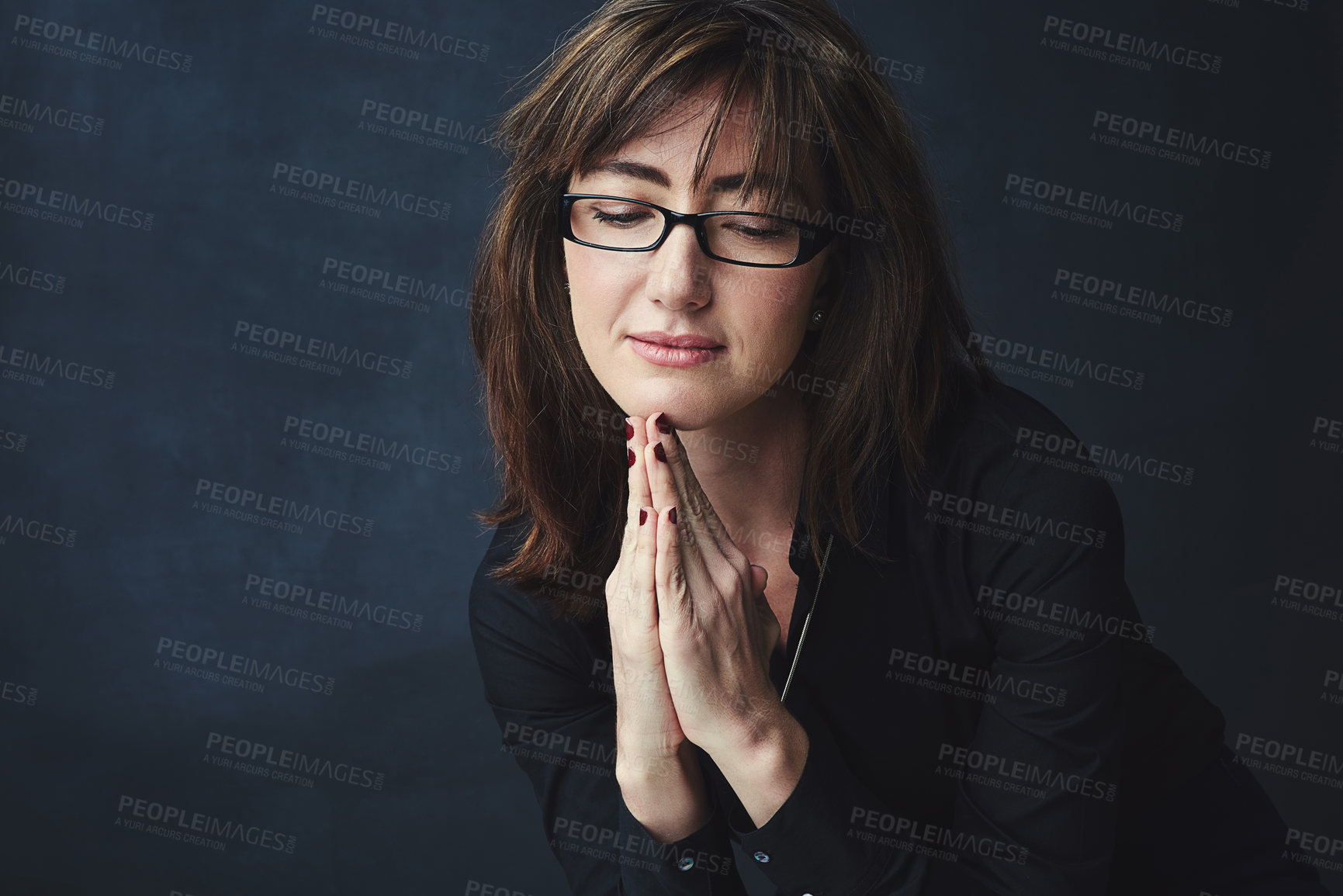 Buy stock photo Studio shot of a corporate businesswoman posing against a dark background