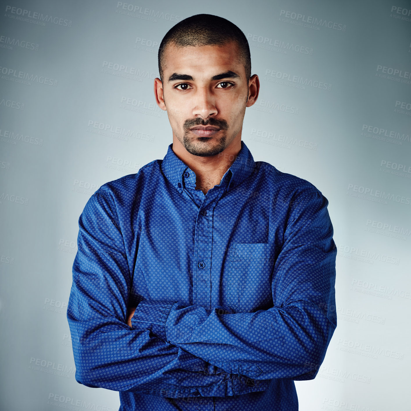 Buy stock photo Cropped shot of a young businessman posing against a grey background