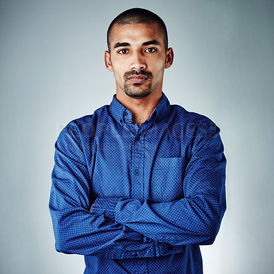 Buy stock photo Cropped shot of a young businessman posing against a grey background