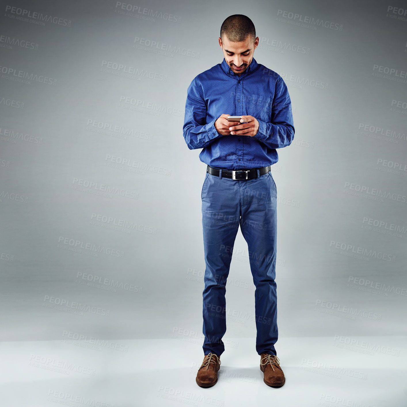 Buy stock photo App, phone and space with business man in studio for communication, social media or text message. Contact, networking and search with smile of happy employee on gray background mockup for online chat