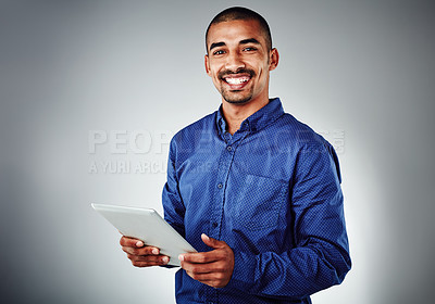 Buy stock photo Happy, portrait and businessman with tablet for creative design, research or project on a gray studio background. Male person, model or employee with smile on technology for online app, UI or UX