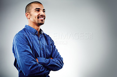 Buy stock photo Cropped shot of a young businessman posing against a grey background