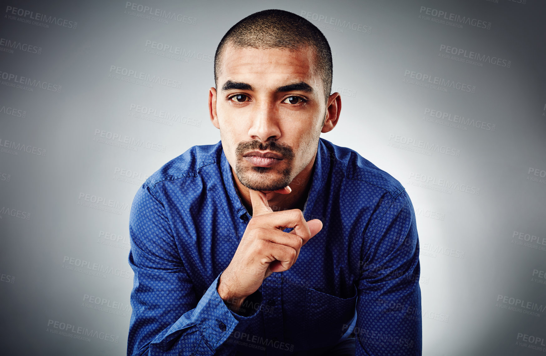 Buy stock photo Cropped shot of a young businessman posing against a grey background